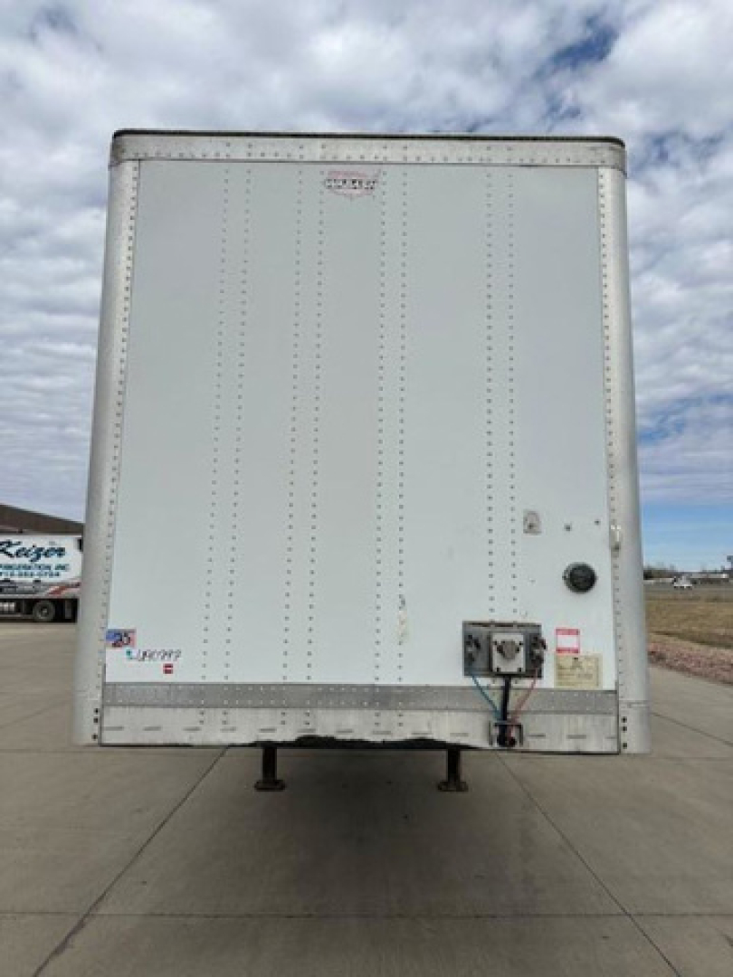 Trailer rear view showing back doors and landing gear on a white Wabash van trailer with VIN 1JJV532D6EL786702 and stock U90797.