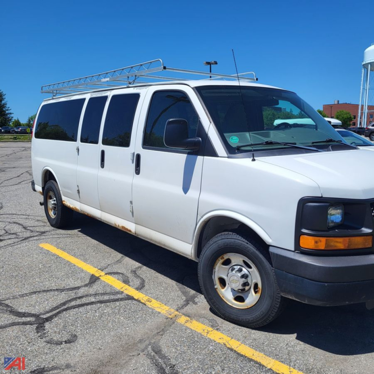 Chevrolet Express Cargo Van in-service showing side and front with roof rack.
