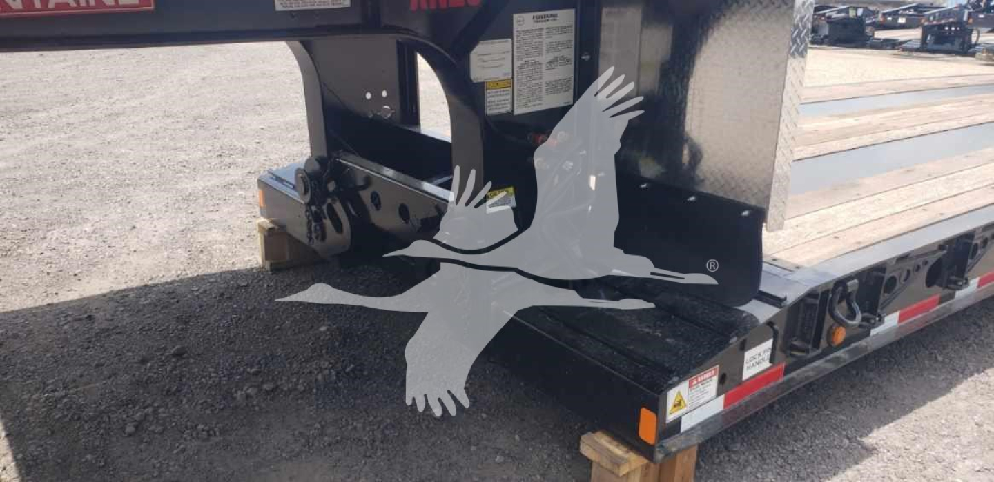 Fontaine Renegade X20 trailer hitch area showing undercarriage and support with safety decals.