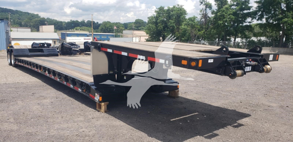 Fontaine Renegade X20 double drop expandable trailer showing gooseneck hitch and low-profile deck with reflective tape.