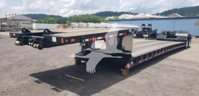 Fontaine Renegade X20 trailer in yard showing double drop expandable trailer with flatbed and gooseneck hitch.