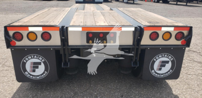 Fontaine renegade X20 double drop expandable trailer rear view showing taillights and Fontaine Specialties mud flaps with logo