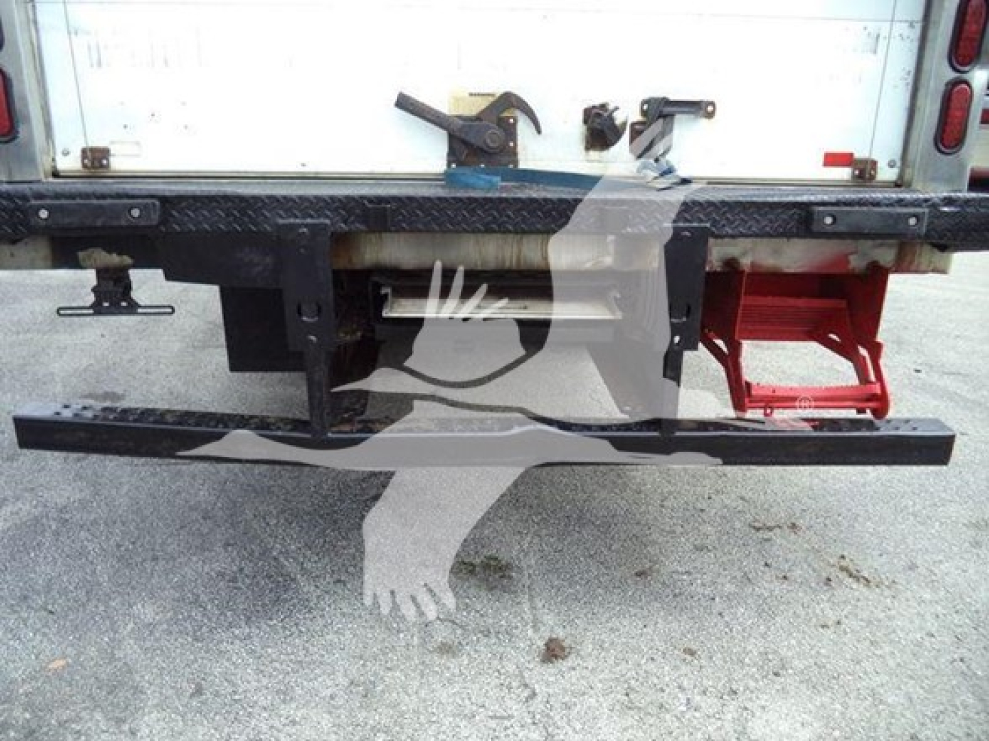 Rear view of a 2019 Hino 195 refrigerated truck showing bumper and hitch with stock number T04018 and VIN JHHHDM2H7KK004018.