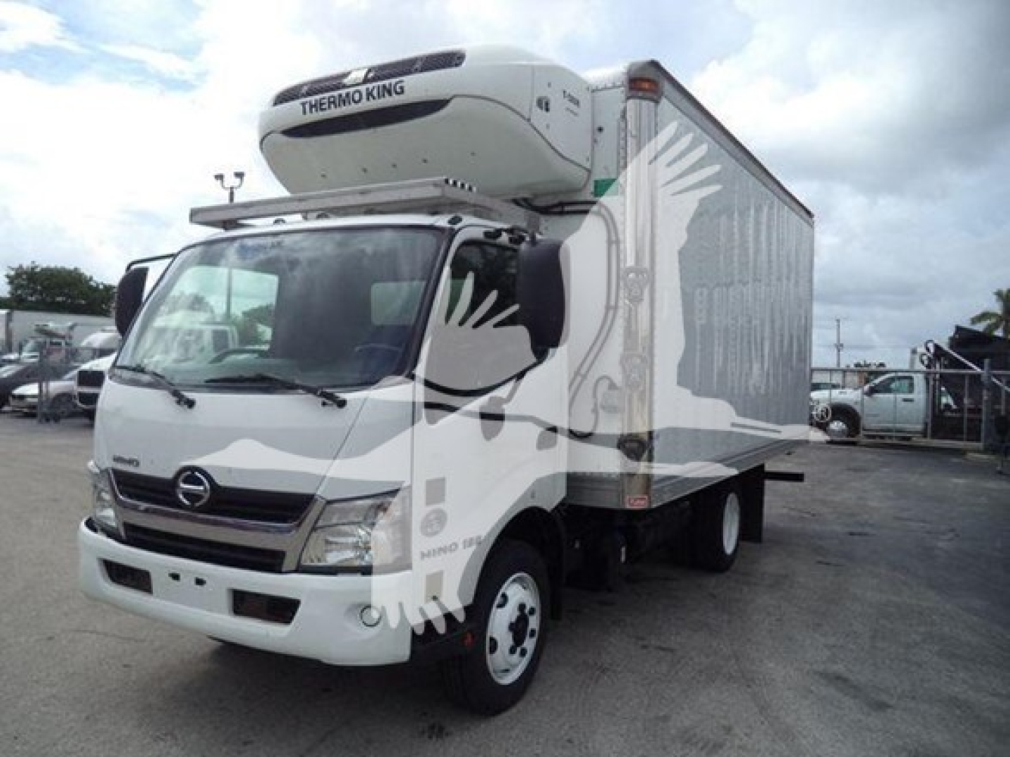 Hino 195 refrigerated truck with Thermo King unit on top, side cargo door visible, front grille and cab in view.