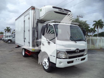 Rear-view of a white 2019 Hino 195 refrigerated truck with Thermo King unit on top, side refrigeration cargo box, front cab with Hino badge.