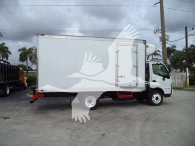 2019 Hino 195 refrigerated truck side view with white box body and cab, showing stock number T04018 and visible VIN partial plates.