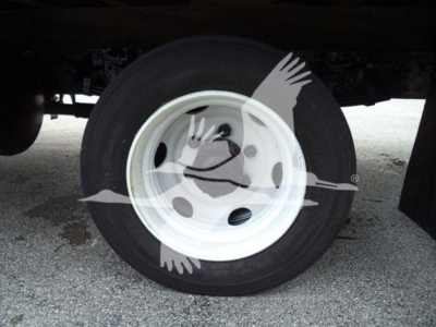 Wheel and tire assembly on a refrigerated 2019 Hino 195 truck showing white steel wheel and black tire.