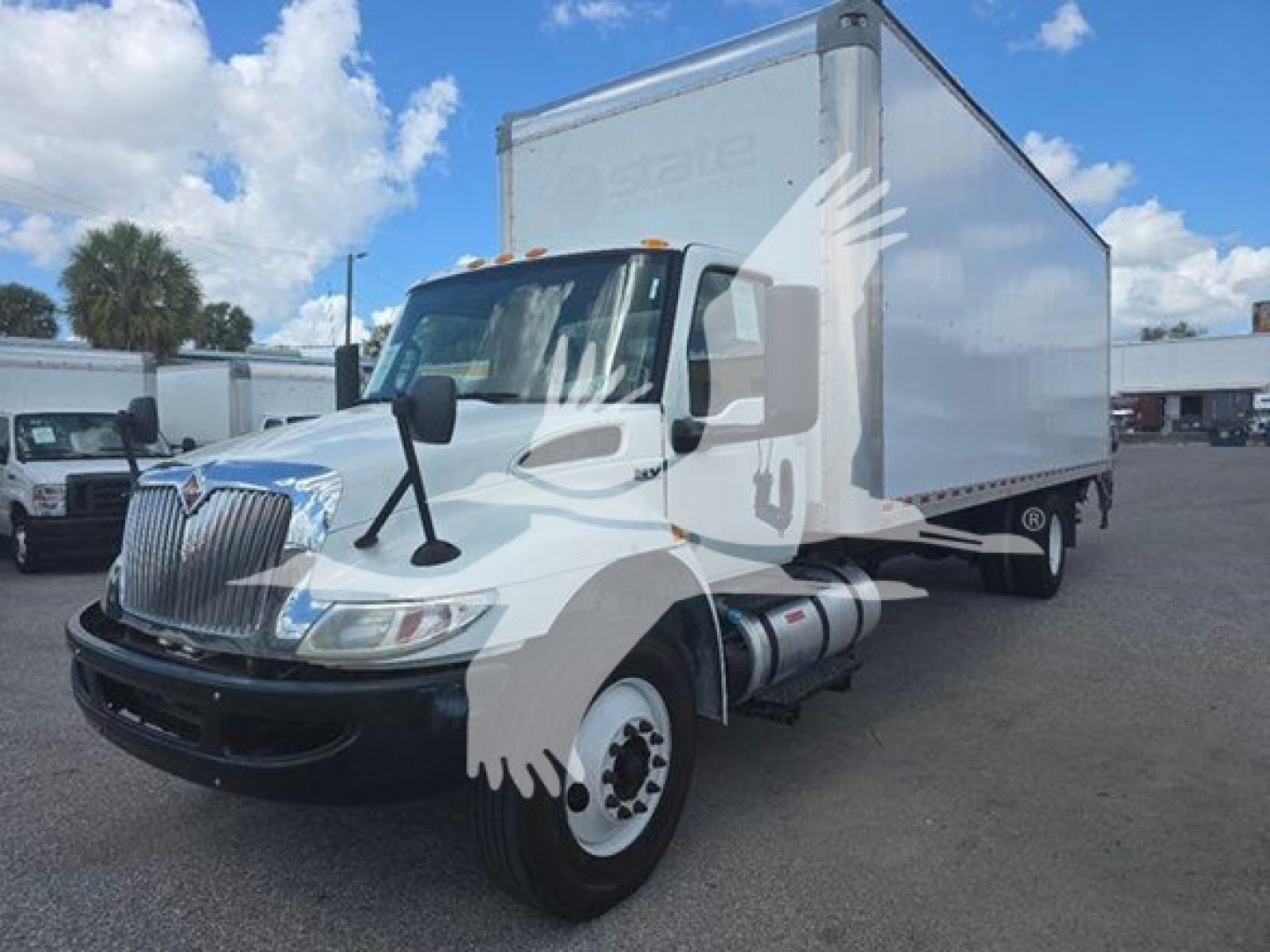 Box truck with cab and large box cargo area, International logo on grille, VIN 3HAEUMMLXLL820885 visible