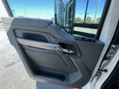 Kenworth T880 truck cab interior door panel view with window controls.