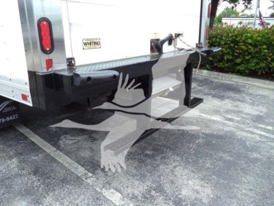 Isuzu NQR rear view showing underrun impact guard and refrigerated truck rear with Whiting sticker