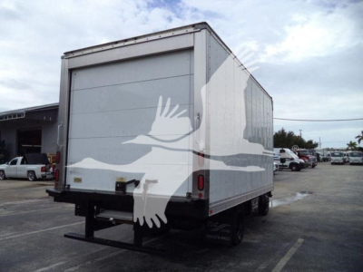 Isuzu NQR refrigerated box truck rear view showing back doors and platform hitch with white bird decal on side.