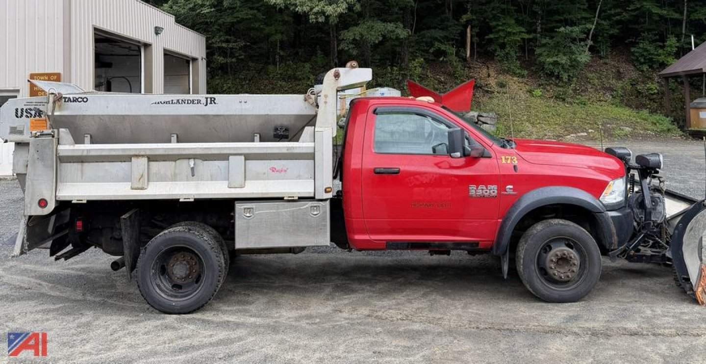 Ram 5500 dump truck with plow and sander in red cab and gray dump body, side view.
