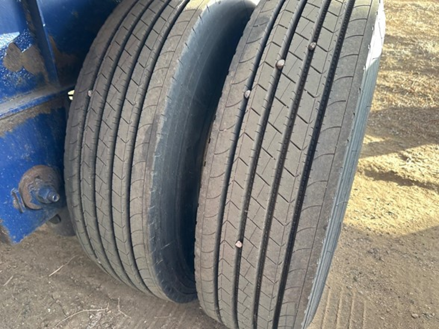 Dual rear tires of a Fontaine Infinity trailer, showing tread and sidewalls; no legible branding or numbers visible.