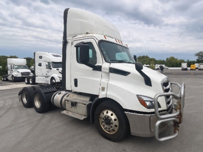 Truck cab showing a 2020 Freightliner Cascadia 116 side view with bull-bar and raised sleeper cab.