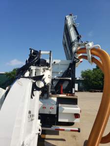 Volvo VHD86B300 truck component showing large hose reel and hydraulic machinery with metal framework and control panels.