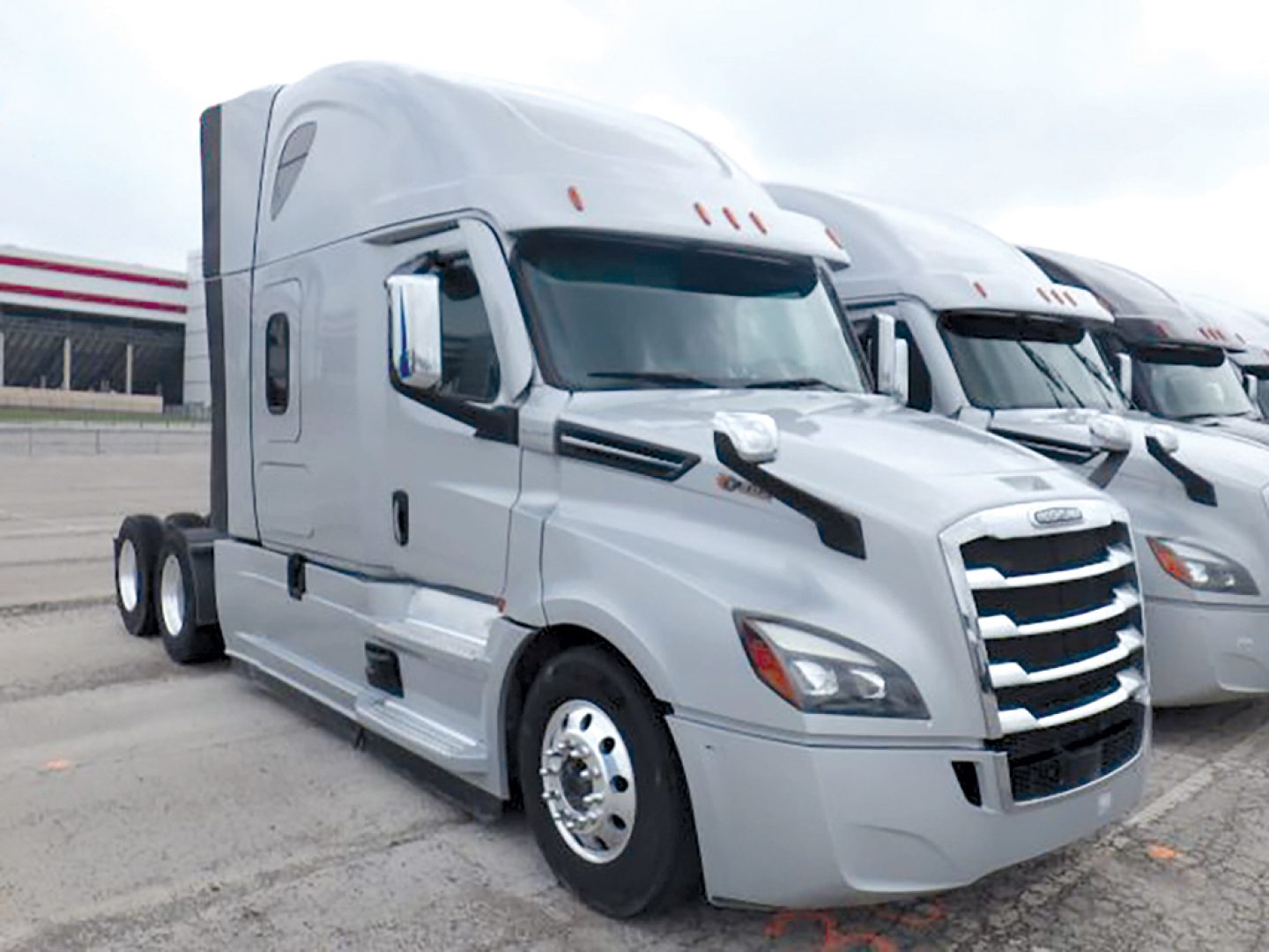 Freightliner Cascadia126 sleeper cab truck in view showing front grille and side profile