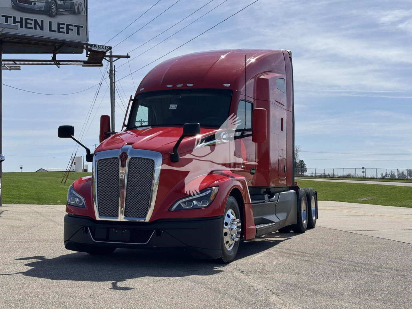 Kenworth T680 tractor-trailer in red, front three-quarter view, with tall sleeper cab and dual rear axles, highway in background.