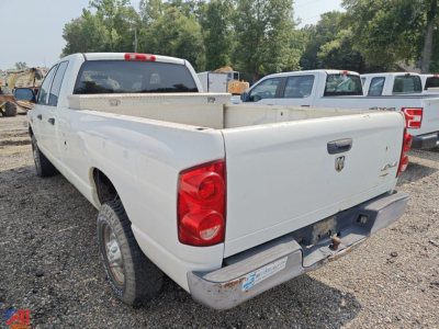 Truck bed of a white 2008 Dodge Ram 2500 Crew Cab pickup viewed from rear left side.