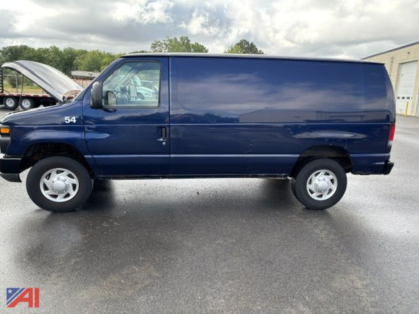 Ford E-350 cargo van side view showing number 54 on front fender and raised hood, solid blue exterior, white wheels, cargo van profile.