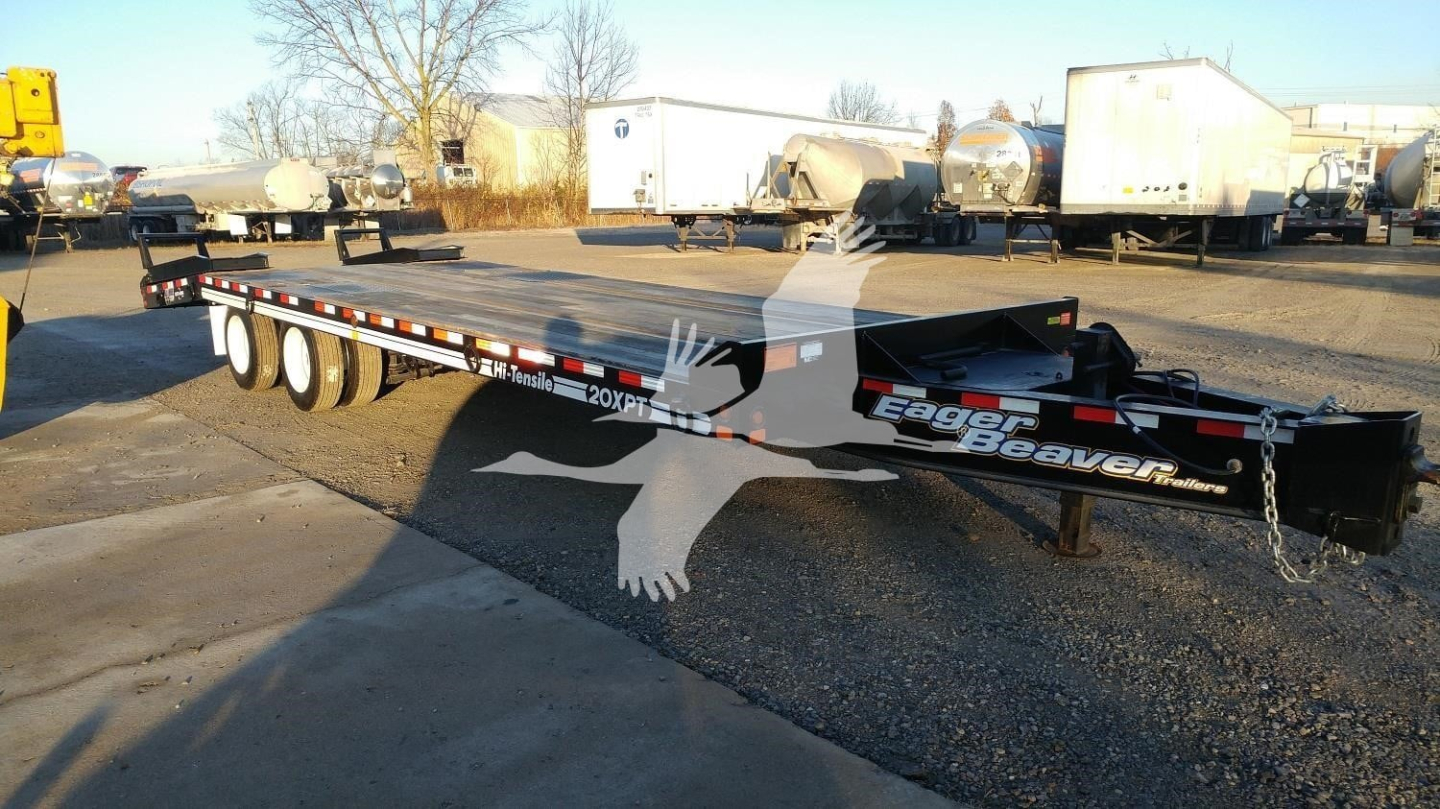 Trailer showing 20XPT model with Eager Beaver branding, flatbed design, in-service equipment yard.