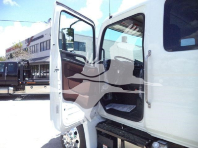 Front cab opening a white 2026 Hino L6 rollback truck showing door open and interior steps visible.