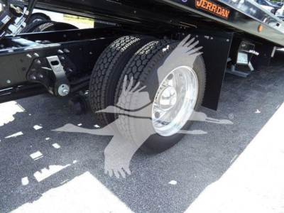 Hino L6 rollback truck rear wheel and chassis view showing dual rear tires and undercarriage components.