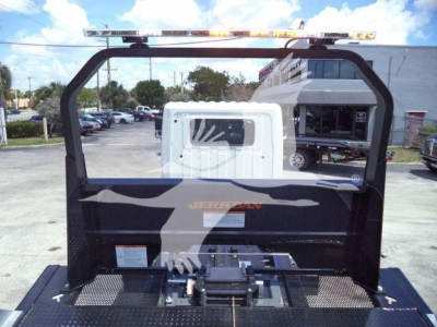 Roll-back truck in image with Jerr-Dan branding and a raised rack frame seen from behind the cab