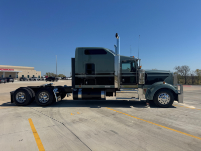 Kenworth W900L tractor in profile view showing chassis and sleeper cab with dual rear axles.