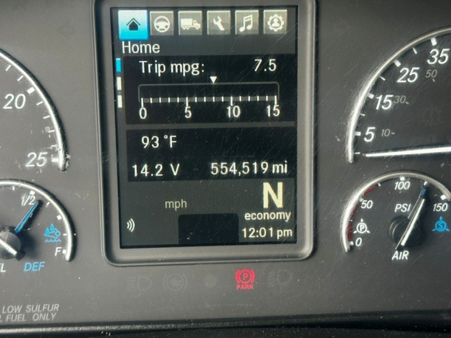 Dashboard cluster of a 2019 Freightliner Cascadia 126 showing digital display with trip mpg 7.5, 14.2 V, 554,519 miles, N gear, 93°F, time 12:01 pm.