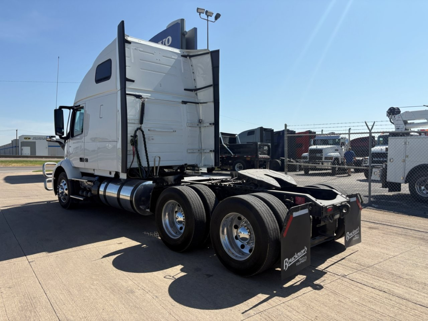 Volvo VNR truck tractor in side view showing sleeper cab, rear axles, fuel tanks, and chassis with fifth-wheel area visible.