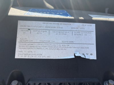 Label on engine information plate with specifications for Volvo engine family PY?T?12 6?B?P, engine model D13-42, serial number 123? and warnings; other lines include DIST, FUEL RATE, EXHAUST EMISSIONS CONTROL, and VOLVO branding.