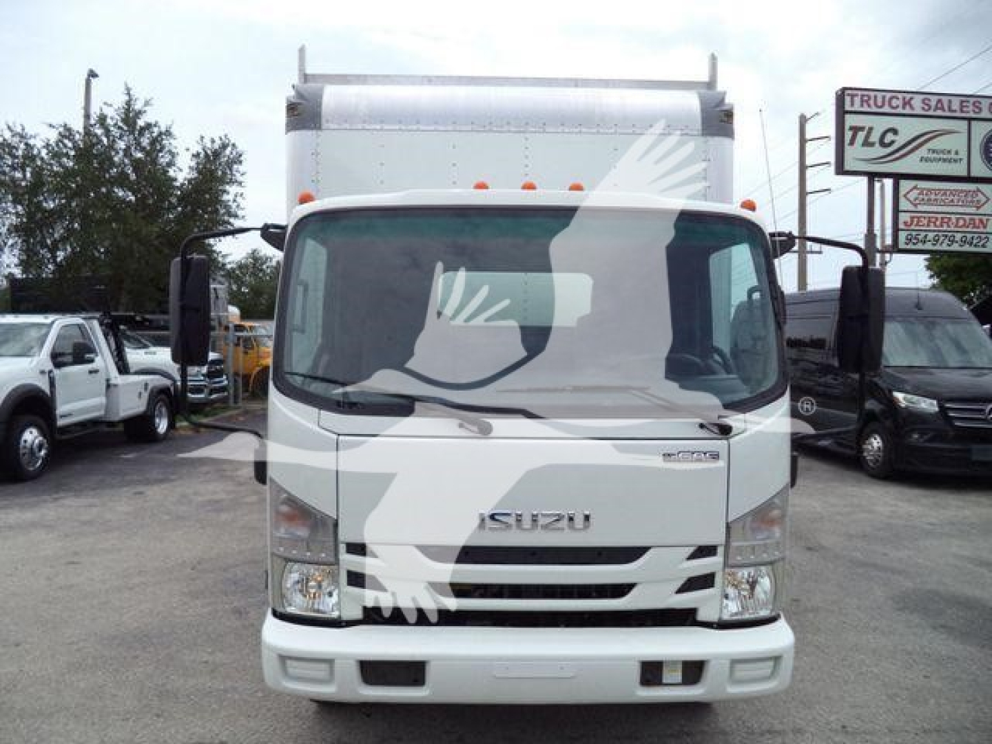 Isuzu NPR-HD box truck front view with stock number T14653FM in a dealership lot