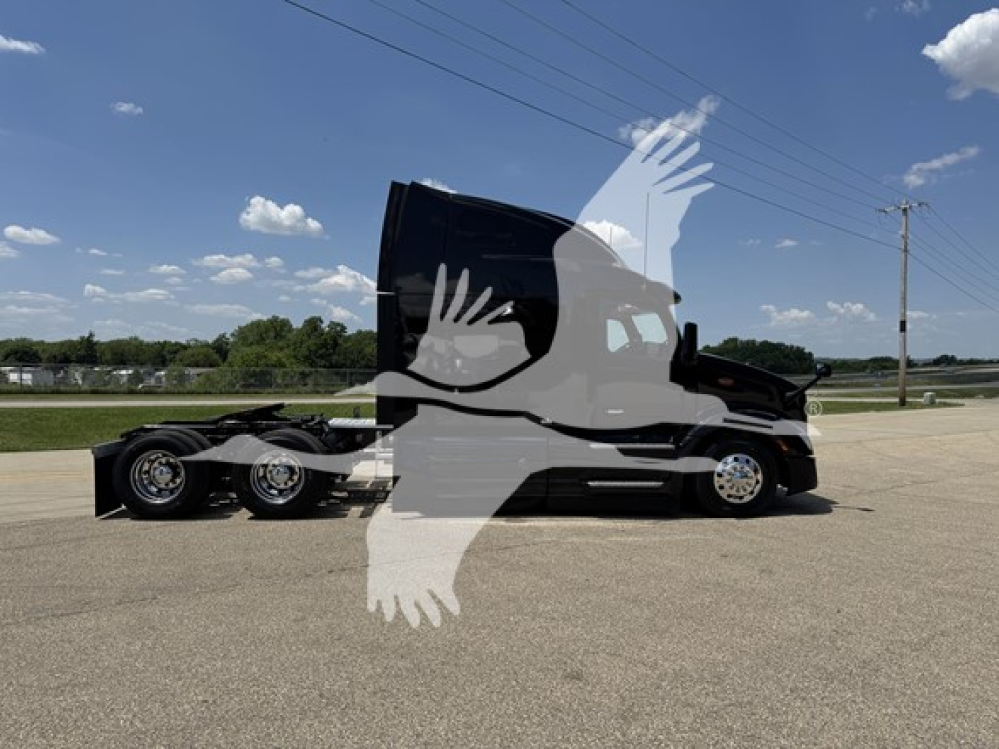 Peterbilt 579 tractor (conventional sleeper) side view with canopy raised, showing cab and sleeper area, no visible text legible on parts.