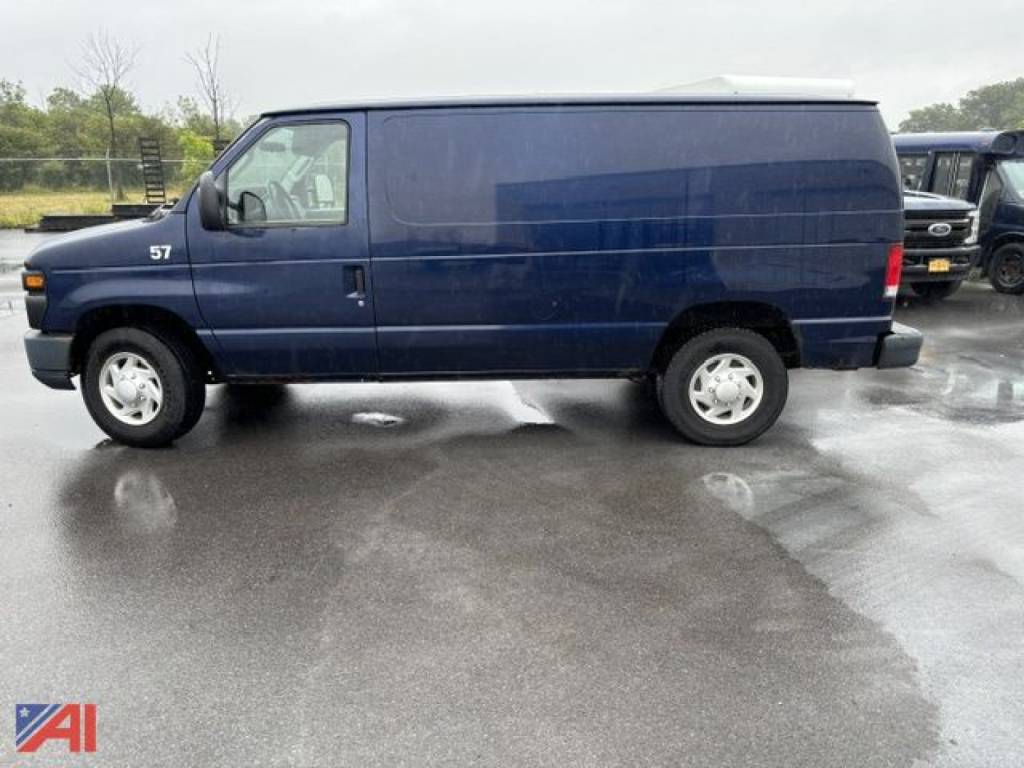 Ford E-350 cargo van side view showing blue cargo van with white wheels and '57' on front door