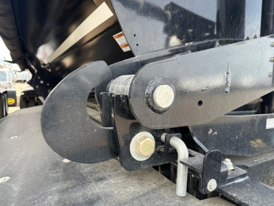 Hydraulic cylinder and mounting hardware on a Jet Air Ride Side Dump trailer showing a pin, bolt, and linkage near the frame.