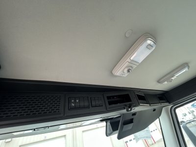 Dashboard area of new 2027 Mack AN64T showing overhead console and switches.