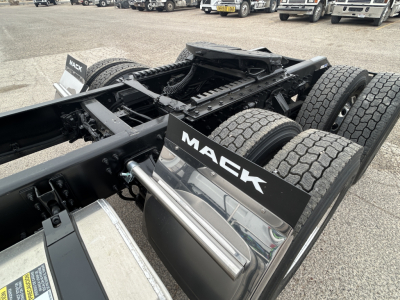 Mack AN64T chassis showing dual rear axles and fifth wheel area with Mack branding panels.
