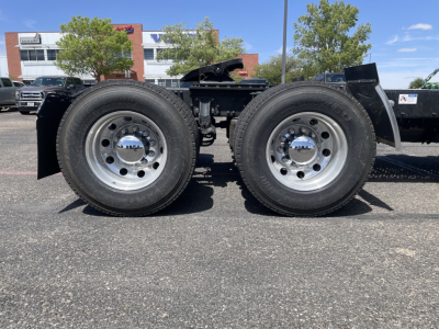 Dual rear axles of a Mack AN64T truck chassis showing wheels, tires, and frame
