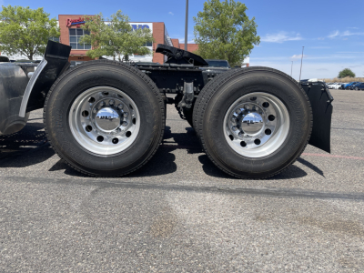 Mack AN64T truck chassis showing dual rear wheels and wheel hubs with polished rims.
