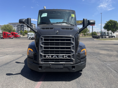 Mack AN64T conventional daycab front view showing bold grille with MACk letters, large bumper, and dual cab mirrors.