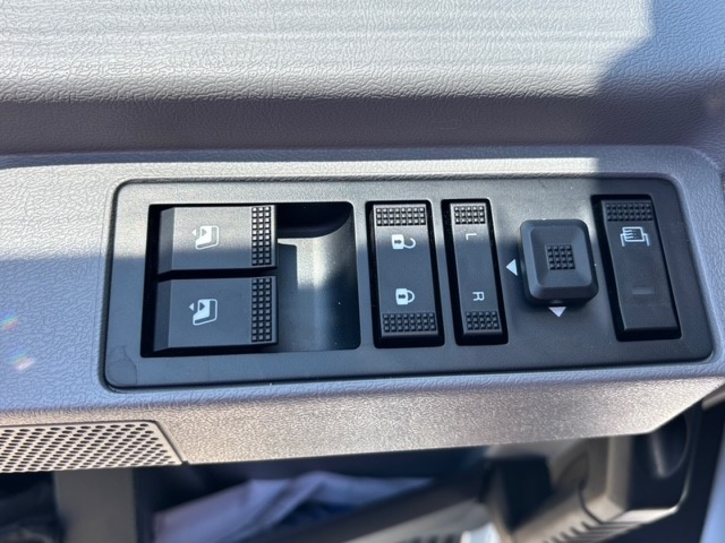 Mack MD7 control panel with window/lock controls and memory switches in cabin interior view.