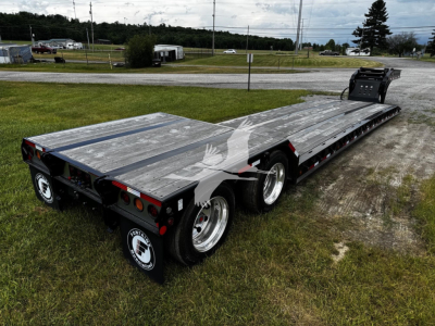 Fontaine N20 lowboy trailer in a parking area showing long aluminum deck, triple axle, and rear ramps. Stock number T35A5590 with VIN 13N350209T35A5590 visible.
