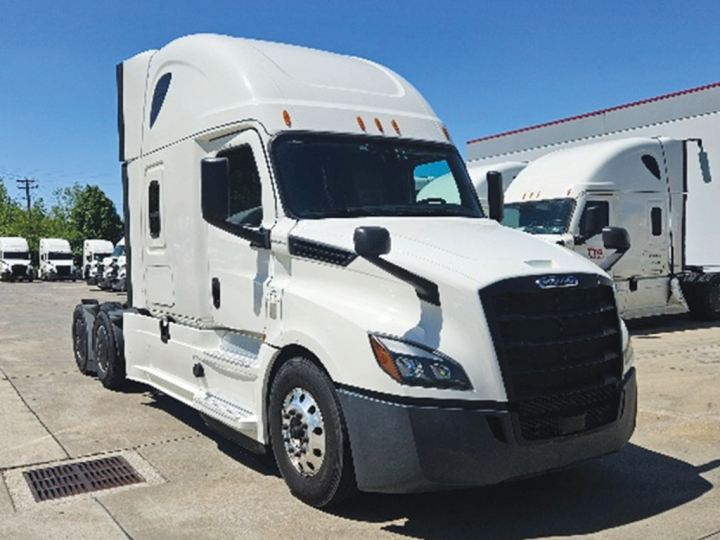 Truck: 2020 Freightliner Cascadia126 sleeper cab, white high-roof, front grille, side mirrors, dual rear axles visible, parked in lot.