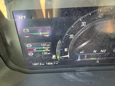 Mack PR64T instrument cluster showing 84°F, two pressure gauges at 131 psi and 130 psi, and odometer 1507.3 miles; gauge with N2 Eco indicators.