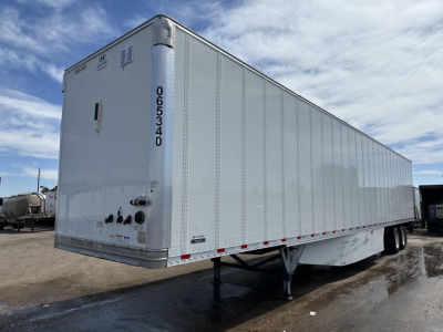 Hyundai air ride dry van trailer with silver aluminum exterior and rear swing doors, high roof, dual rear wheels, front landing gear visible.