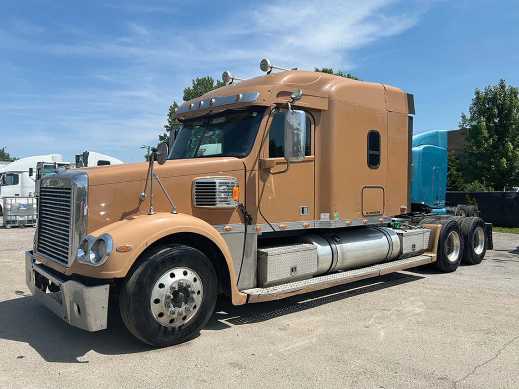 Freightliner Coronado 2015 conventional sleeper truck in tan color,-side view with sleeper cab and fuel tanks