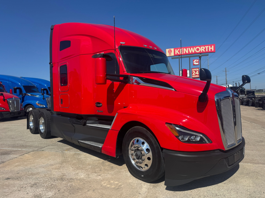 Kenworth T680 semi-truck in red color profile view showing cab and dual rear axles.