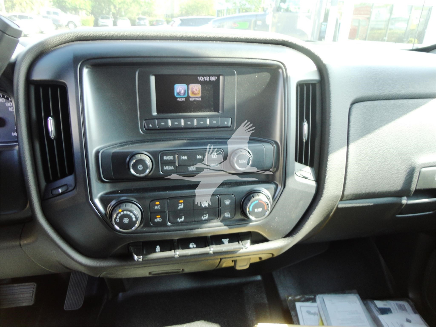 Chevrolet Silverado 5500HD dash and center console showing infotainment screen and climate controls.