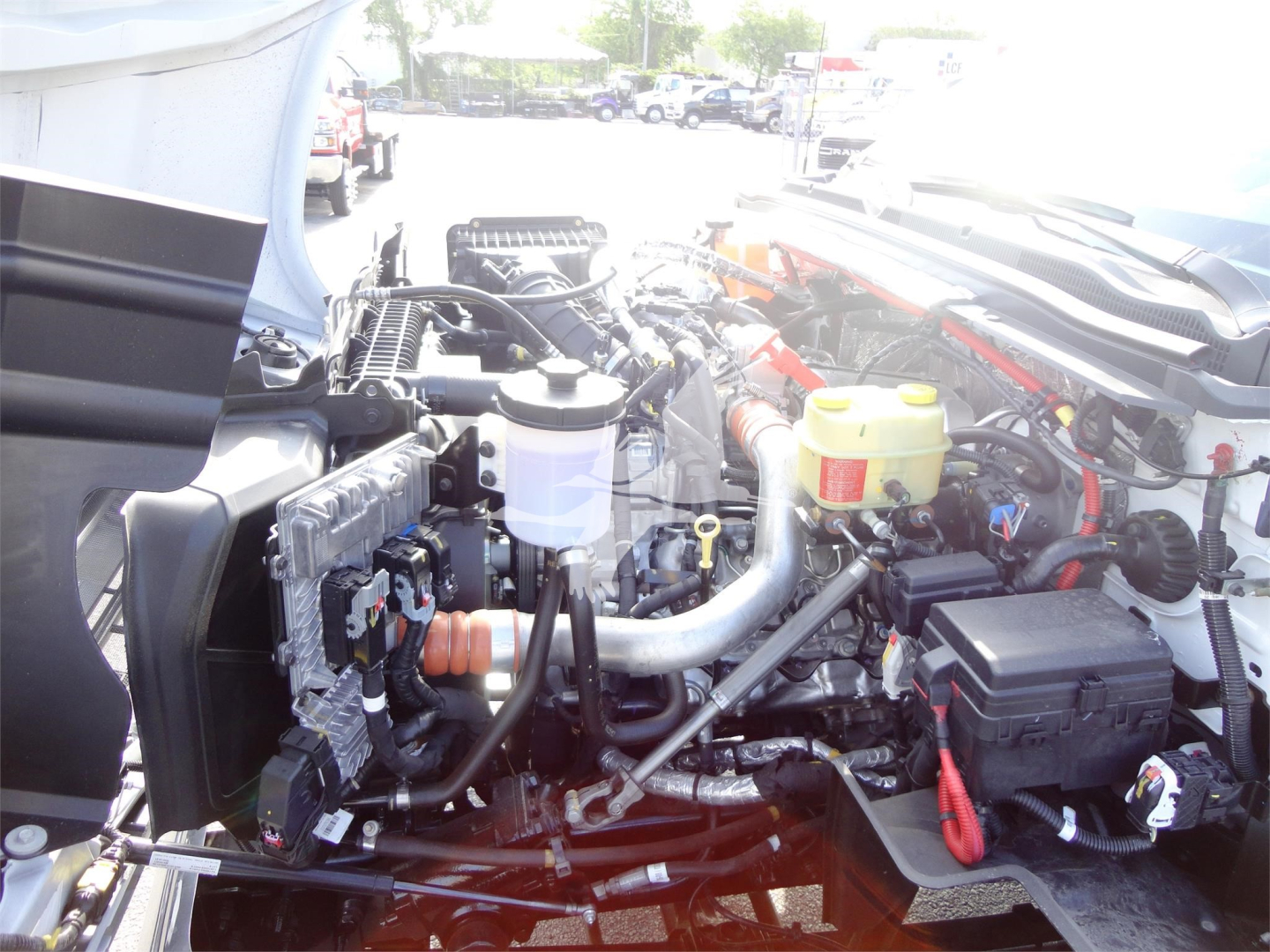 Chevrolet Silverado 5500HD engine bay showing various fluid reservoirs and mechanical components.