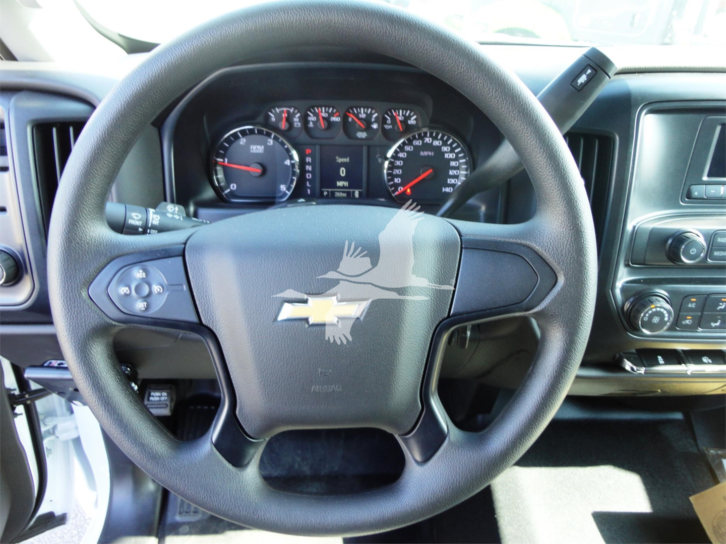 Chevrolet Silverado 5500HD steering wheel and dashboard interior showing instrument cluster and center console.